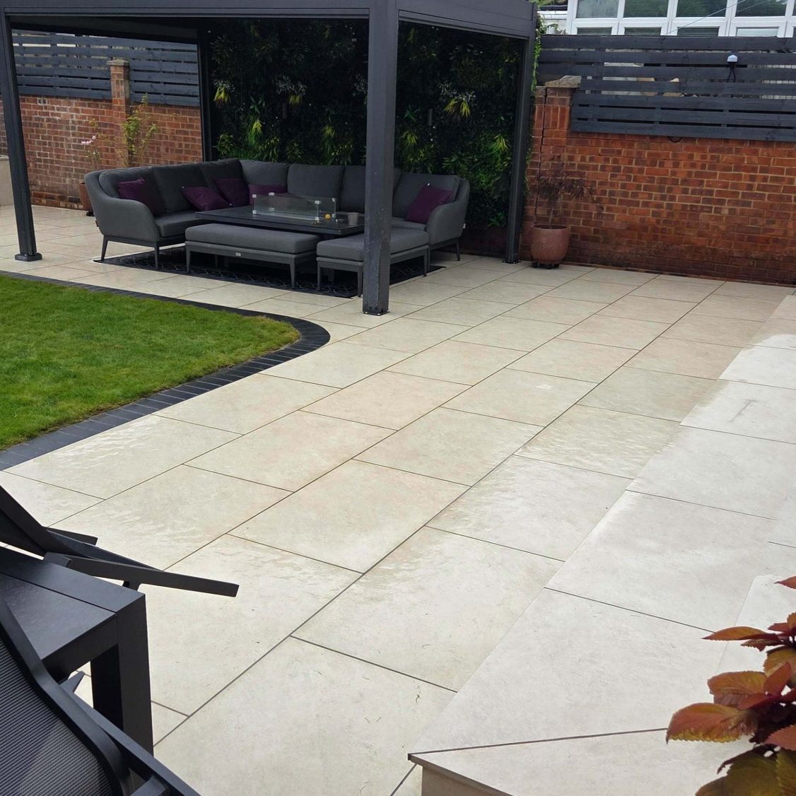 scream paving and pergola with seating area